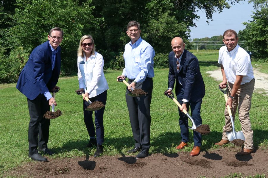 Speakers at the Farm Foundation Innovation and Education Center groundbreaking ceremony dig a symbolic shovelful of soil.