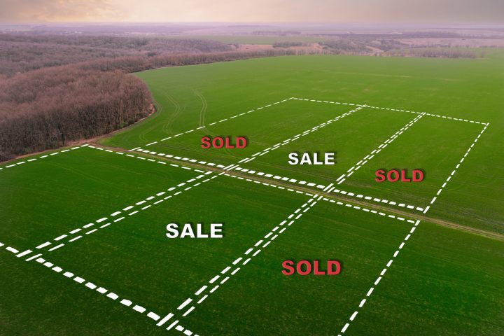 Plots of farm field with crops for sale - aerial top view with Sale and Sold Text